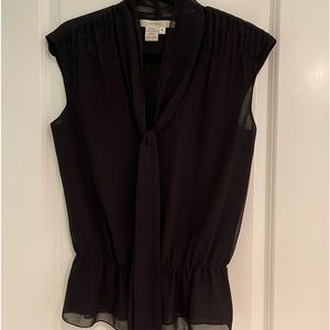 Great layering top for work or a night out.  Fits true to size.